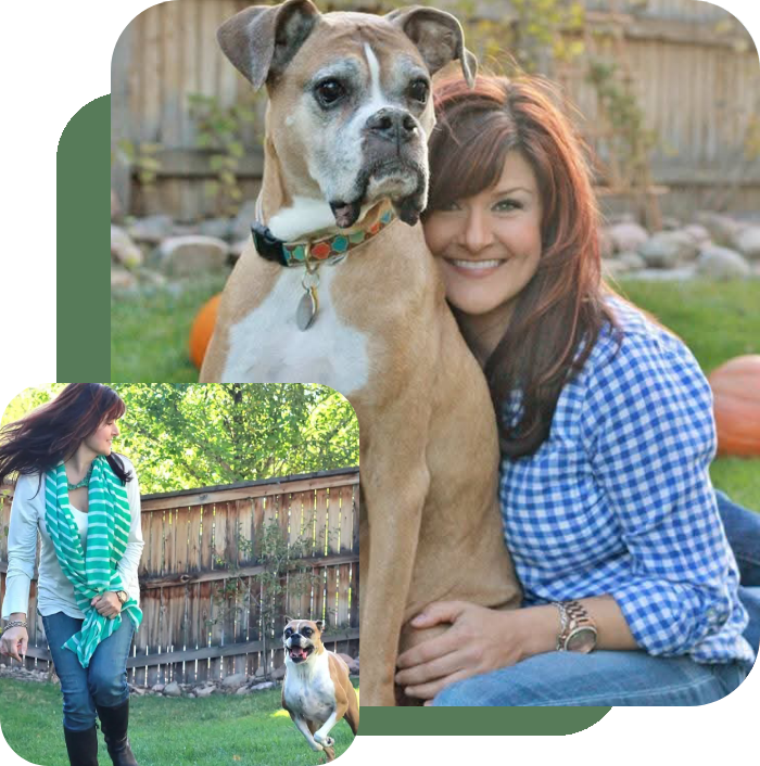 A woman affectionately hugging a large dog outdoors.